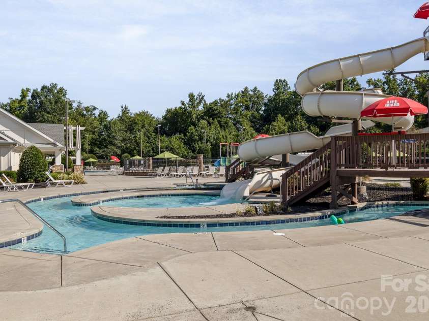 3018 Oakmere Road, Waxhaw, NC 28173.  MLS# CAR4431624, YatesRealty ID 54879. Waterslide at one of multiple community pools