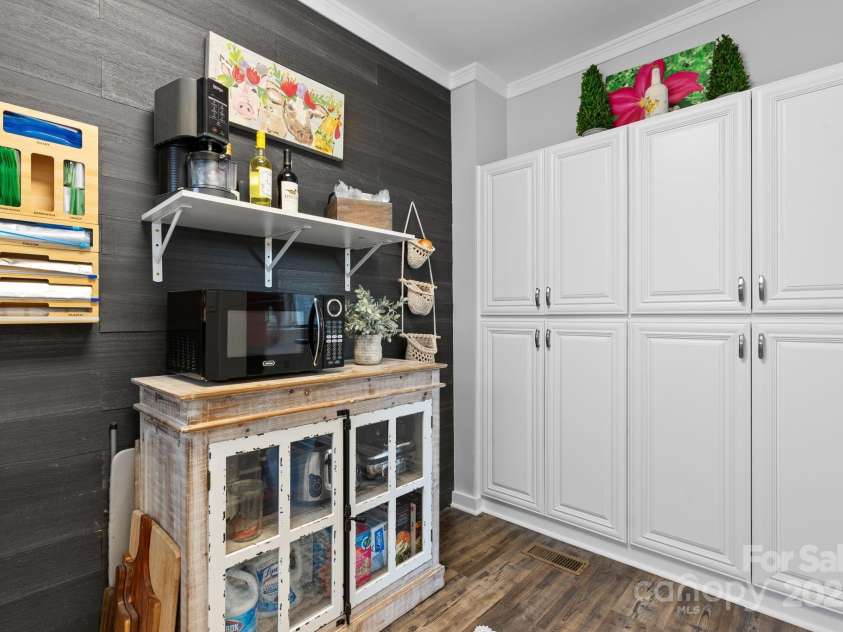 704 Main Avenue, Newton, NC 28658.  MLS# CAR4275934, YatesRealty ID 5489. Extra storage/ pantry off kitchen in Laundry Room.