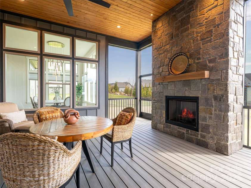 274 Daniel Circle Drive, Mills River, NC 28759.  MLS# CAR4241570, YatesRealty ID 5490. Fireplace on screened porch