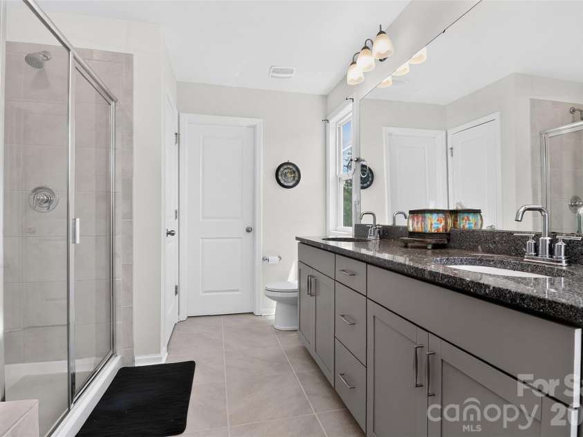 1019 Chicory Trace, Clover, SC 29710.  MLS# CAR4400233, YatesRealty ID 54923. Modern primary bath with dual vanities, linen closet and walk-in closet