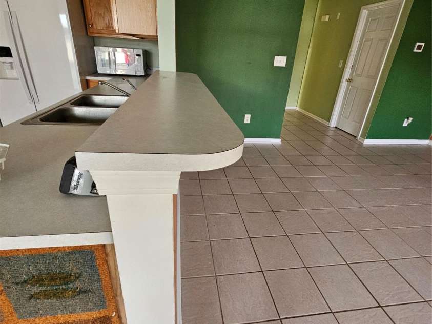 3308 Covelo Court, Charlotte, NC 28262.  MLS# CAR4355252, YatesRealty ID 5495. Breakfast bar at the kitchen