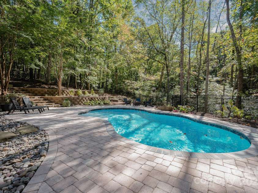7029 Pebble Bay Drive, Denver, NC 28037.  MLS# CAR4192335, YatesRealty ID 5495. Beautiful 30'custom gunite saltwater heated pool (2021