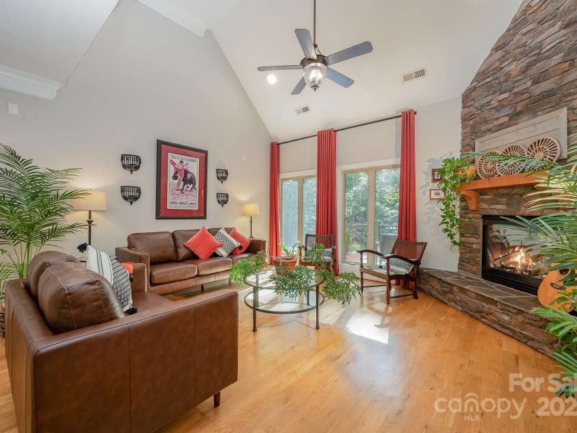 7029 Pebble Bay Drive, Denver, NC 28037.  MLS# CAR4192335, YatesRealty ID 5495. Family room opens to kitchen and dining area.