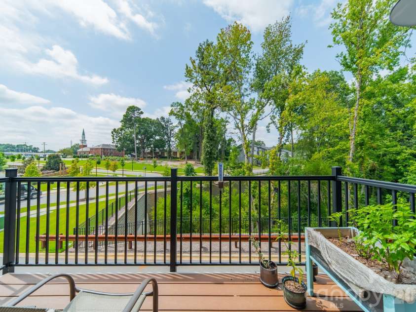 2025 Evolve Way, Charlotte, NC 28205.  MLS# CAR4355059, YatesRealty ID 5496. Balcony off Kitchen