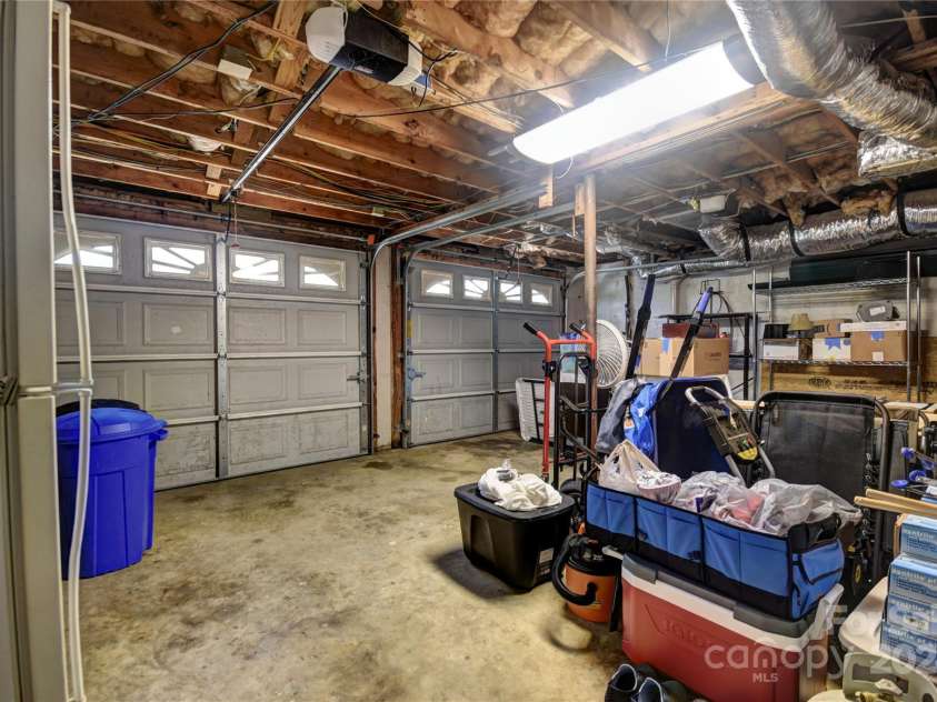 201 Acorn Lane, Clyde, NC 28721.  MLS# CAR4153632, YatesRealty ID 5499. 2 Car Garage in the Basement