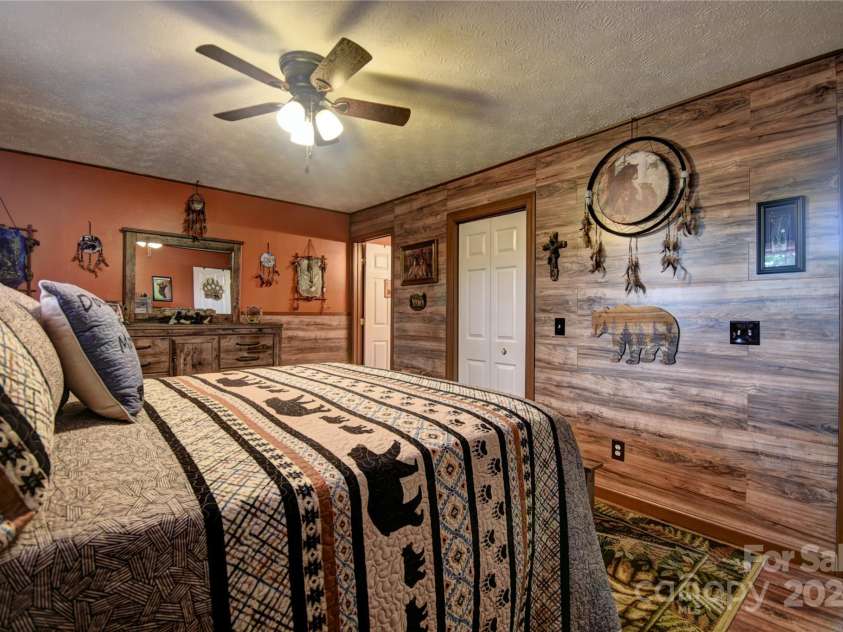 201 Acorn Lane, Clyde, NC 28721.  MLS# CAR4153632, YatesRealty ID 5499. Alternate Photo of the Primary Bedroom
