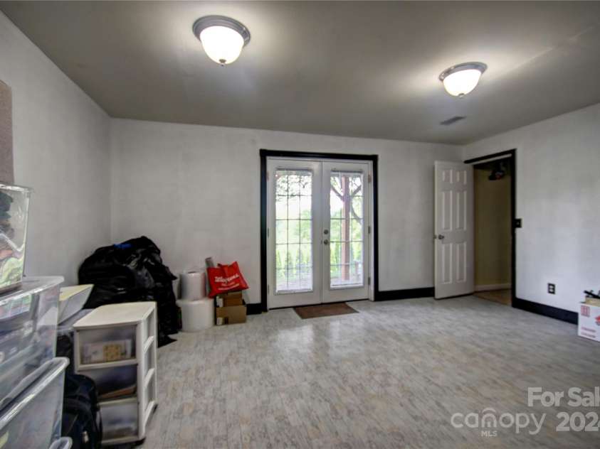 201 Acorn Lane, Clyde, NC 28721.  MLS# CAR4153632, YatesRealty ID 5499. Another View of the Rec Room showing the patio door