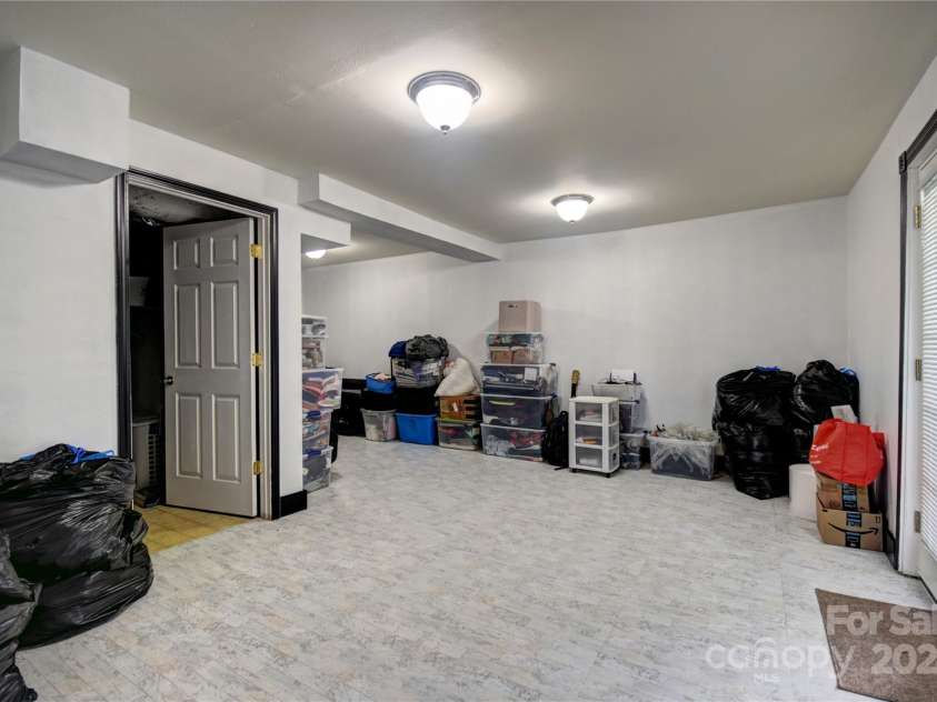 201 Acorn Lane, Clyde, NC 28721.  MLS# CAR4153632, YatesRealty ID 5499. Large Rec Room, or what-have-you room in the Basement