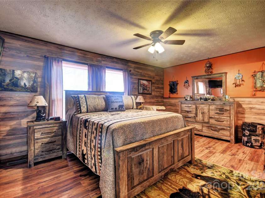 201 Acorn Lane, Clyde, NC 28721.  MLS# CAR4153632, YatesRealty ID 5499. Primary Bedroom is on the main level