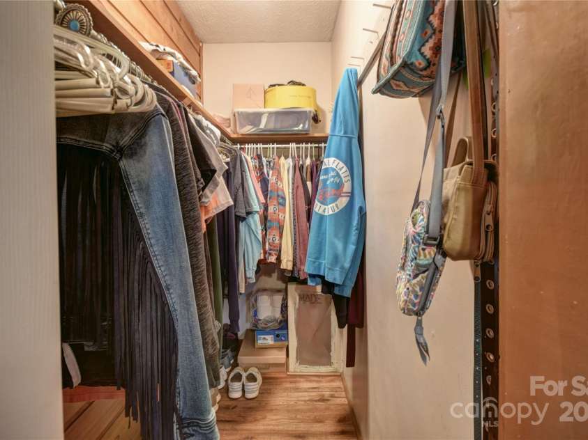 201 Acorn Lane, Clyde, NC 28721.  MLS# CAR4153632, YatesRealty ID 5499. Primary Bedroom Walk-In Closet
