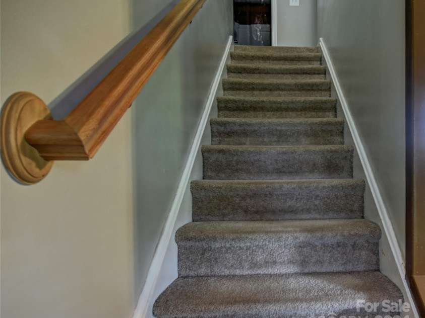 201 Acorn Lane, Clyde, NC 28721.  MLS# CAR4153632, YatesRealty ID 5499. Stairs to the Upper Level