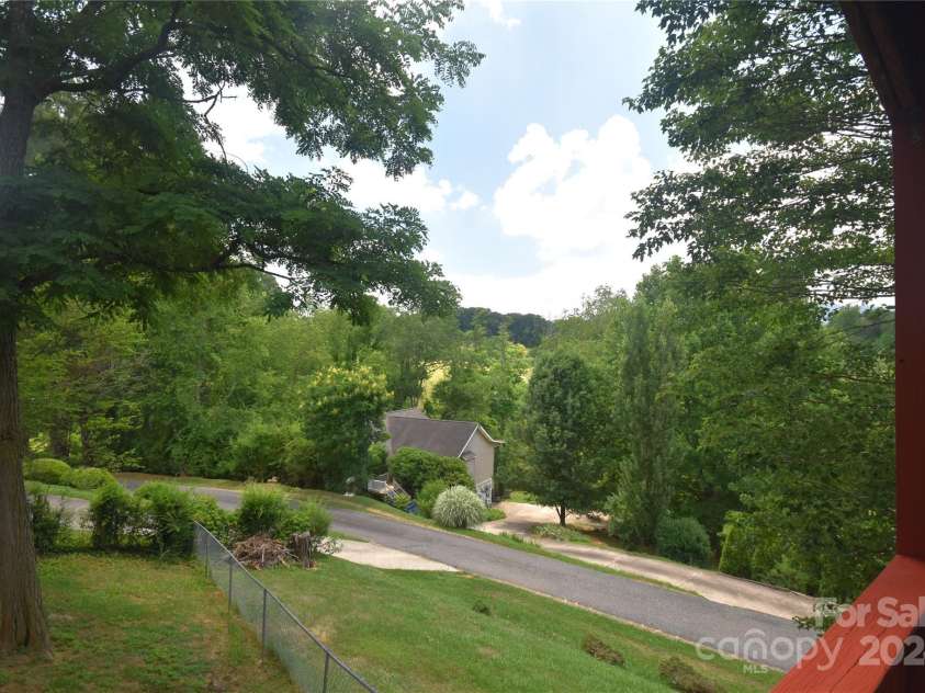 201 Acorn Lane, Clyde, NC 28721.  MLS# CAR4153632, YatesRealty ID 5499. View from the porch, better mountain views in the winter