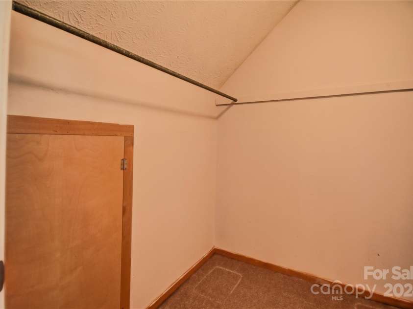 201 Acorn Lane, Clyde, NC 28721.  MLS# CAR4153632, YatesRealty ID 5499. Walk-In Closet off BR 3 with storage access