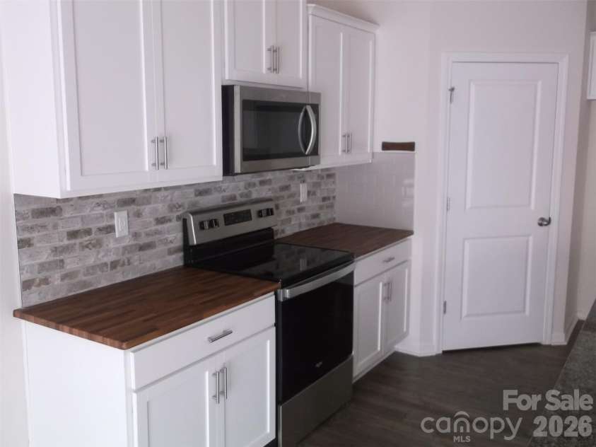 214 Wildflower Drive, Locust, NC 28097.  MLS# CAR4431888, YatesRealty ID 54990. 