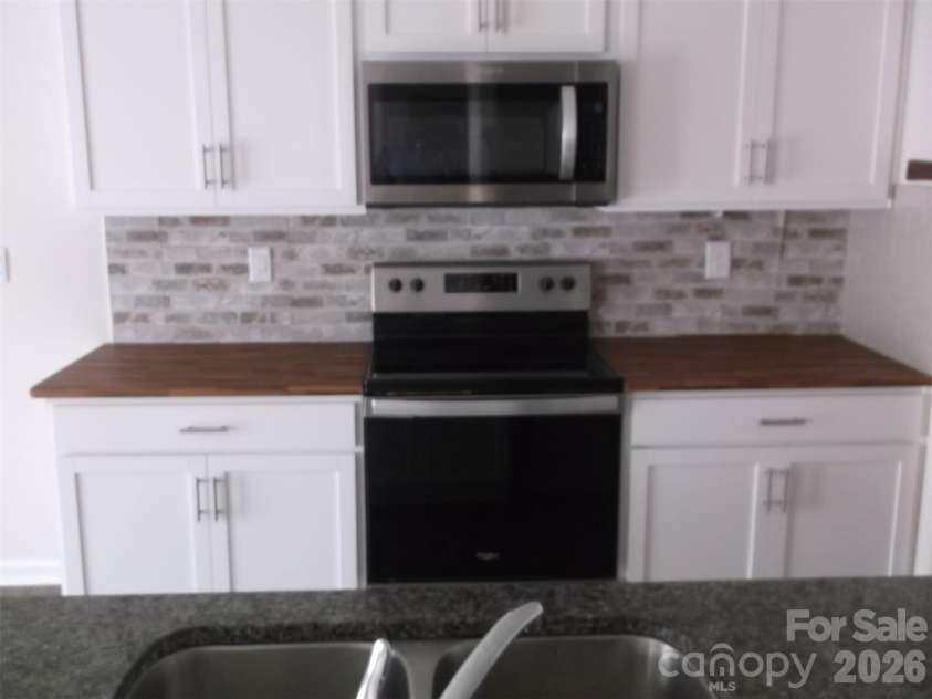 214 Wildflower Drive, Locust, NC 28097.  MLS# CAR4431888, YatesRealty ID 54990. 