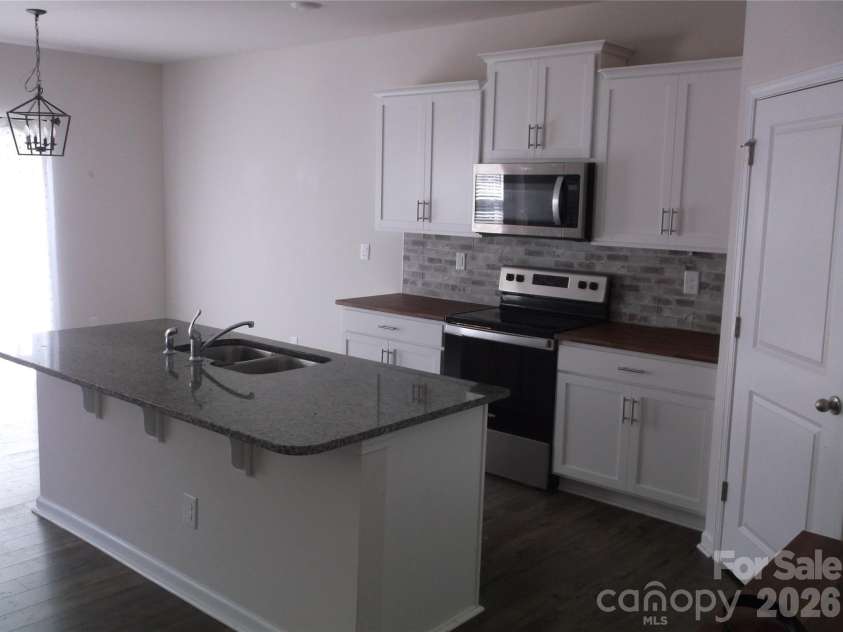 214 Wildflower Drive, Locust, NC 28097.  MLS# CAR4431888, YatesRealty ID 54990. 