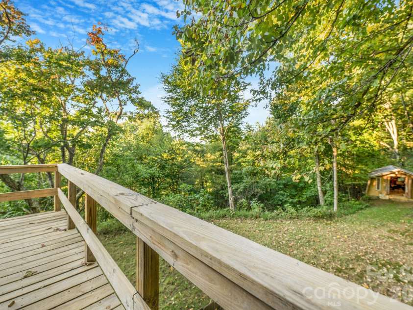 74 Lanzi Ledge Road, Leicester, NC 28748.  MLS# CAR4423050, YatesRealty ID 55008. Looking toward fire pit/barn
