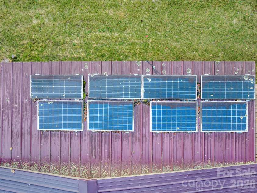 74 Lanzi Ledge Road, Leicester, NC 28748.  MLS# CAR4423050, YatesRealty ID 55008. Seller-installed rooftop solar panels