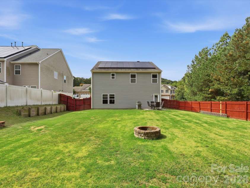 2104 Argentum Avenue, Indian Land, SC 29707.  MLS# CAR4429934, YatesRealty ID 55011. Large Backyard with Firepit