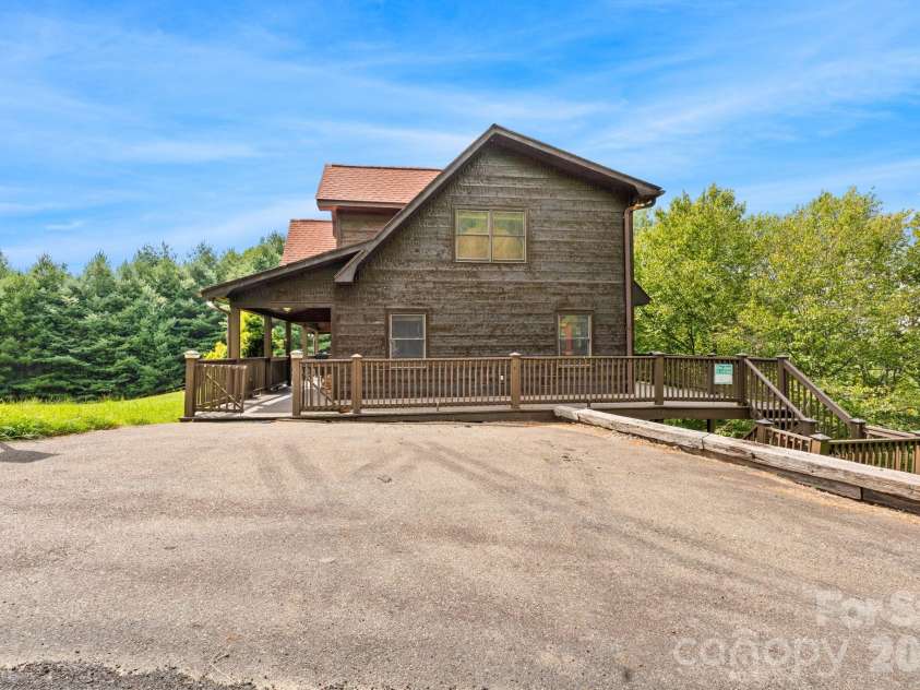1003 Deerwood Road, Piney Creek, NC 28663.  MLS# CAR4431542, YatesRealty ID 55017. Driveway View