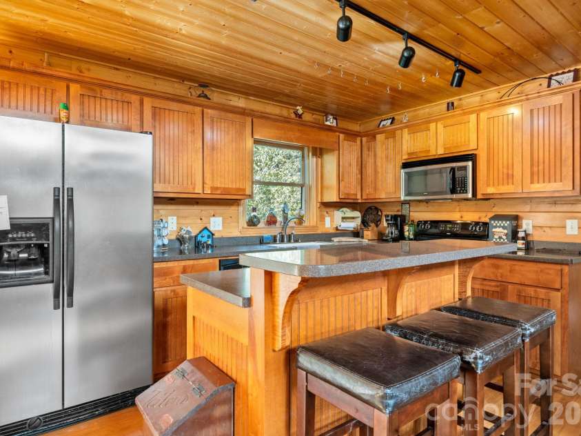 1003 Deerwood Road, Piney Creek, NC 28663.  MLS# CAR4431542, YatesRealty ID 55017. Kitchen Eating Area for Three