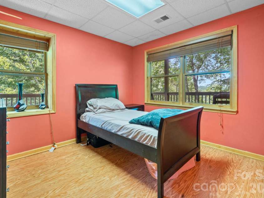 1003 Deerwood Road, Piney Creek, NC 28663.  MLS# CAR4431542, YatesRealty ID 55017. Lower Level Bedroom 3