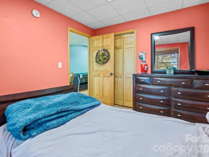 1003 Deerwood Road, Piney Creek, NC 28663.  MLS# CAR4431542, YatesRealty ID 55017. Lower Level Bedroom 3
