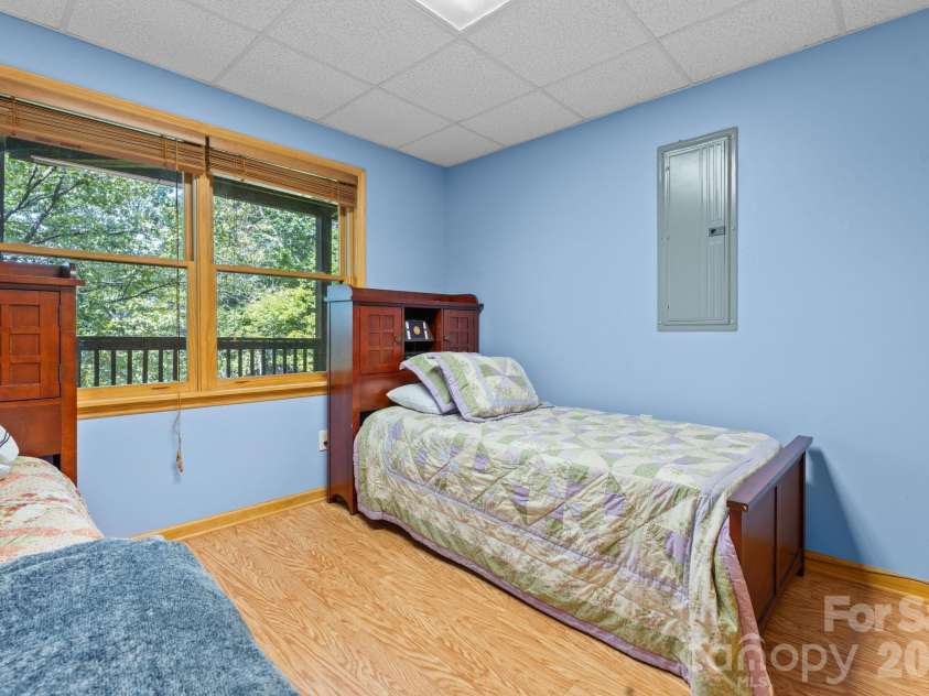 1003 Deerwood Road, Piney Creek, NC 28663.  MLS# CAR4431542, YatesRealty ID 55017. Lower Level Bedroom