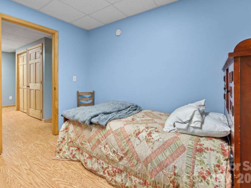 1003 Deerwood Road, Piney Creek, NC 28663.  MLS# CAR4431542, YatesRealty ID 55017. Lower Level Bedroom