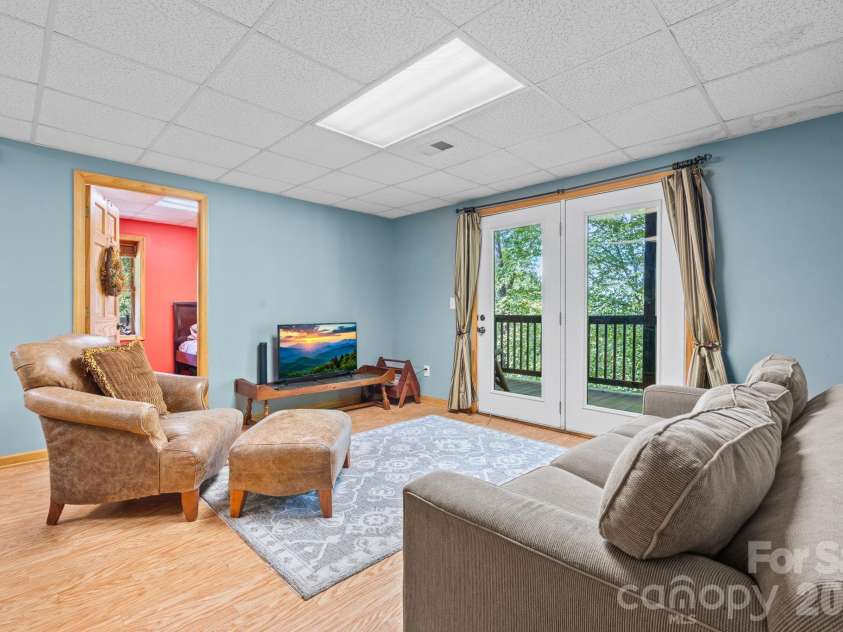 1003 Deerwood Road, Piney Creek, NC 28663.  MLS# CAR4431542, YatesRealty ID 55017. Lower Level Den