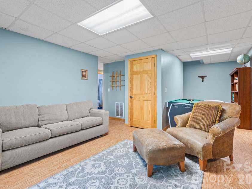 1003 Deerwood Road, Piney Creek, NC 28663.  MLS# CAR4431542, YatesRealty ID 55017. Lower Level Den