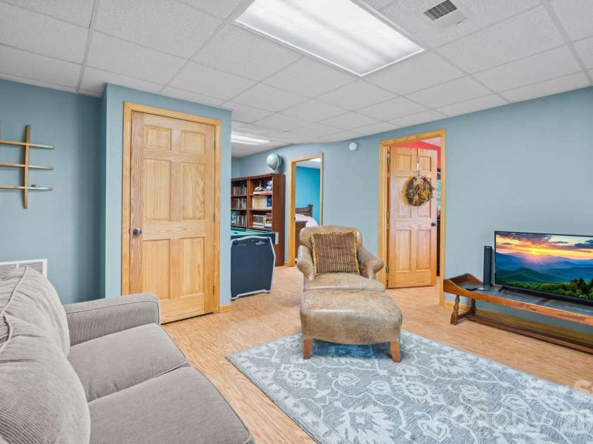 1003 Deerwood Road, Piney Creek, NC 28663.  MLS# CAR4431542, YatesRealty ID 55017. Lower Level Den