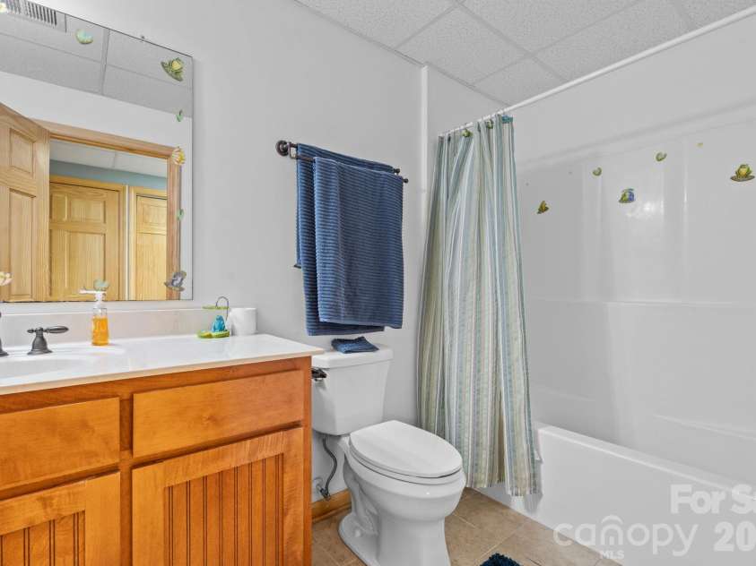 1003 Deerwood Road, Piney Creek, NC 28663.  MLS# CAR4431542, YatesRealty ID 55017. Lower Level Full Bathroom