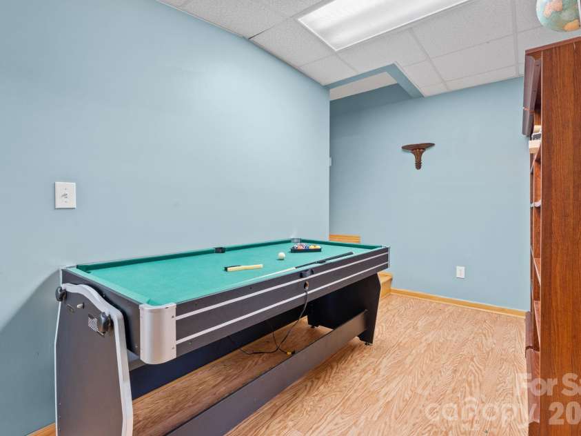 1003 Deerwood Road, Piney Creek, NC 28663.  MLS# CAR4431542, YatesRealty ID 55017. Lower Level Game Room