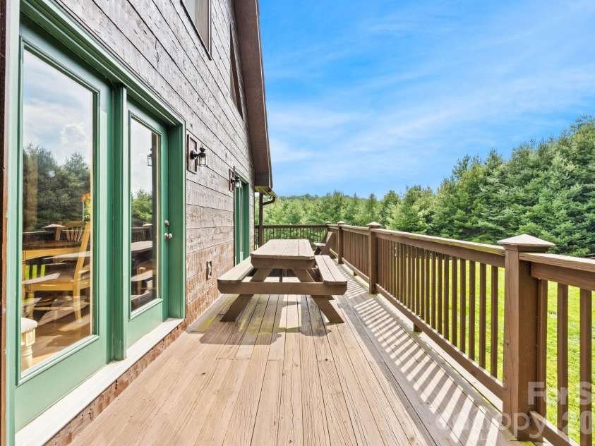 1003 Deerwood Road, Piney Creek, NC 28663.  MLS# CAR4431542, YatesRealty ID 55017. Rear Deck View