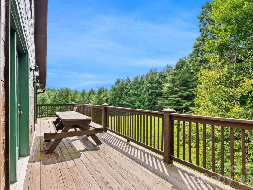 1003 Deerwood Road, Piney Creek, NC 28663.  MLS# CAR4431542, YatesRealty ID 55017. Rear Deck View