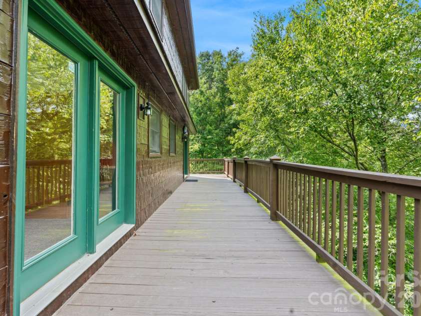 1003 Deerwood Road, Piney Creek, NC 28663.  MLS# CAR4431542, YatesRealty ID 55017. Side Deck View