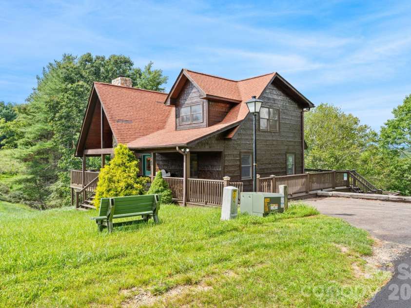 1003 Deerwood Road, Piney Creek, NC 28663.  MLS# CAR4431542, YatesRealty ID 55017. Side Yard View