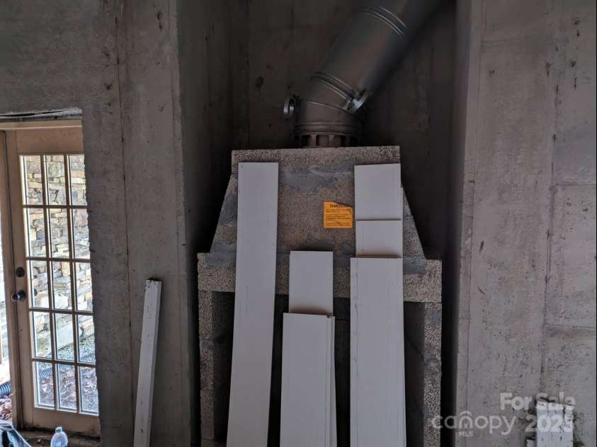 1605 Golden Road, Lake Toxaway, NC 28747.  MLS# CAR4179199, YatesRealty ID 5504. Fireplace in basement