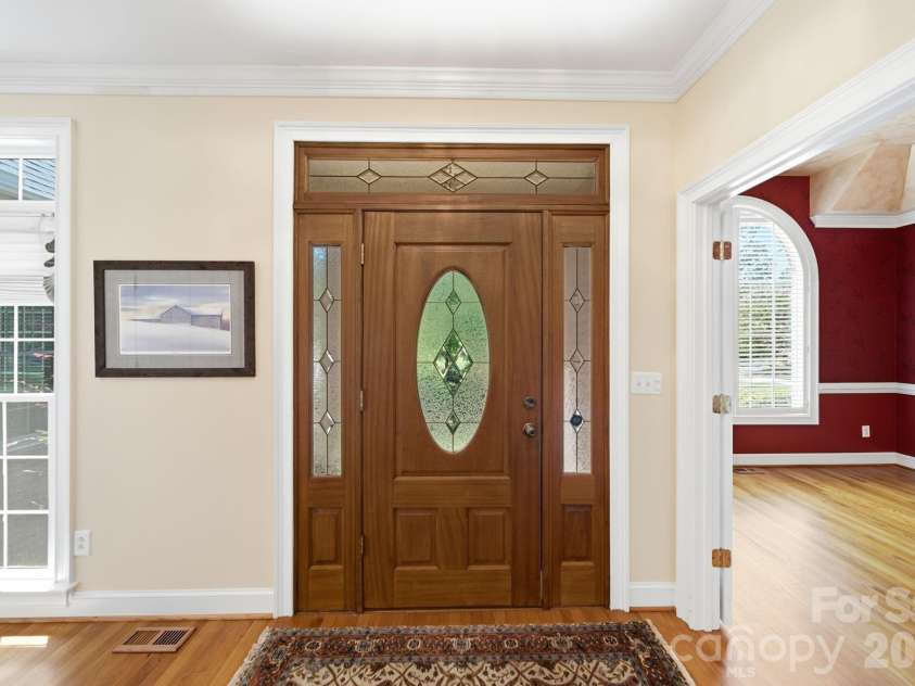 417 Crooked Oak Drive, Oakboro, NC 28129.  MLS# CAR4399226, YatesRealty ID 55048. Entry - Dining Room to the right