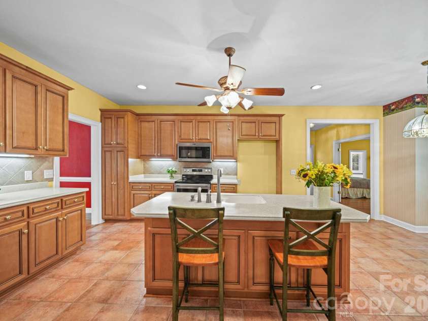 417 Crooked Oak Drive, Oakboro, NC 28129.  MLS# CAR4399226, YatesRealty ID 55048. Kitchen view from Living Room