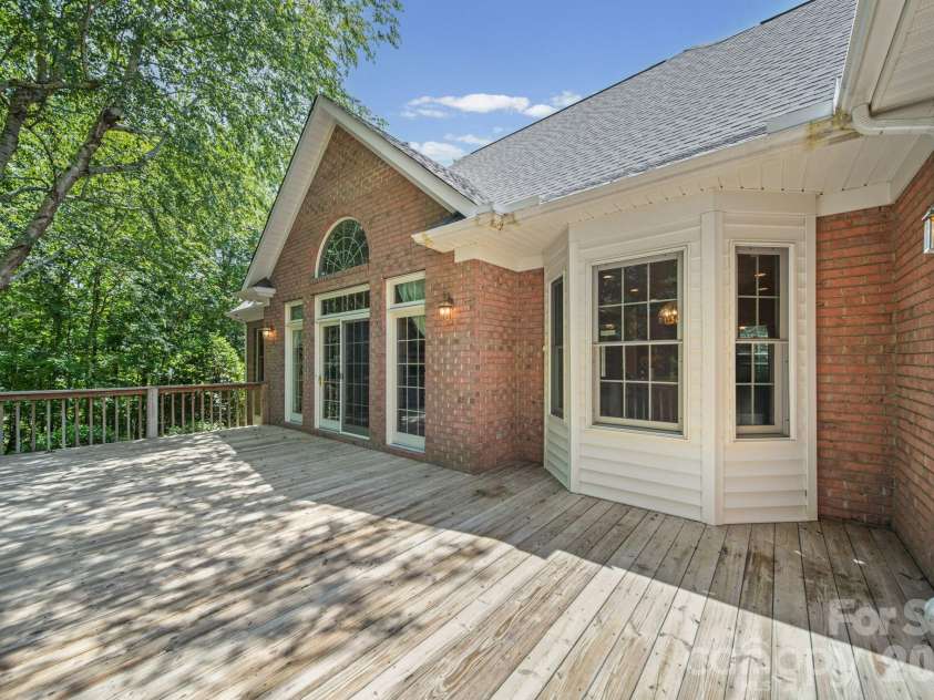 417 Crooked Oak Drive, Oakboro, NC 28129.  MLS# CAR4399226, YatesRealty ID 55048. Rear Deck - Spacious and private