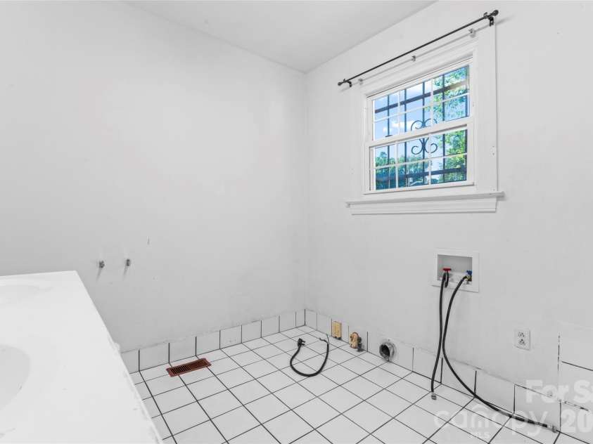 317 Campus Street, Charlotte, NC 28216.  MLS# CAR4329279, YatesRealty ID 5506. Main level full bath has laundry connections.