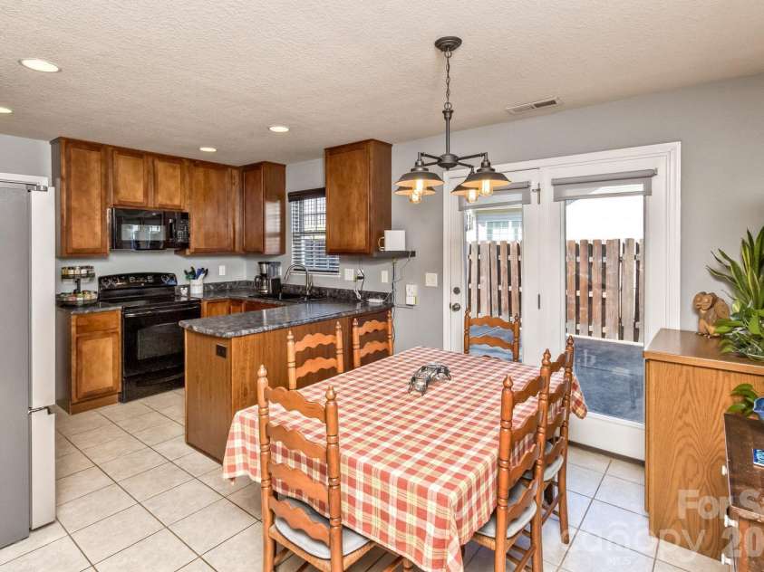 5 Lilac Fields Way, Arden, NC 28704.  MLS# CAR4425374, YatesRealty ID 55081. French doors to the patio