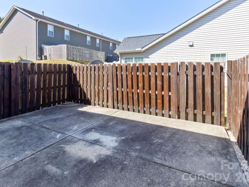 5 Lilac Fields Way, Arden, NC 28704.  MLS# CAR4425374, YatesRealty ID 55081. Patio off the dining room