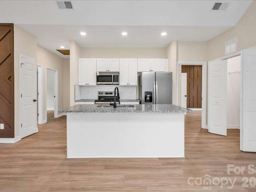 807 Cedar Street, East Spencer, NC 28039.  MLS# CAR4431367, YatesRealty ID 55096. Kitchen with Granite countertops