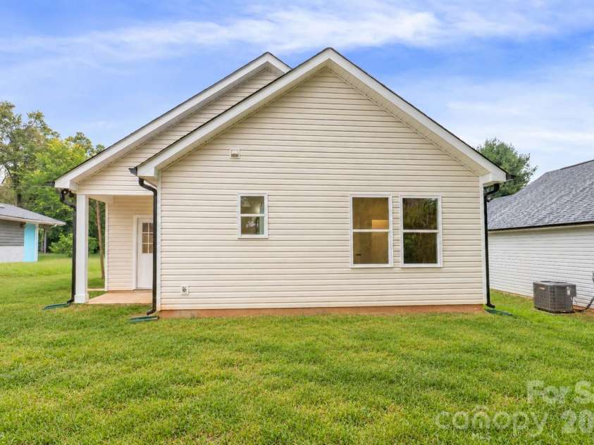 807 Cedar Street, East Spencer, NC 28039.  MLS# CAR4431367, YatesRealty ID 55096. Virtually staged grass