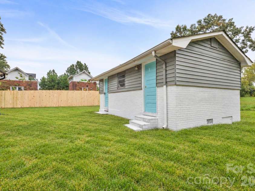 807 Cedar Street, East Spencer, NC 28039.  MLS# CAR4431367, YatesRealty ID 55096. Virtually staged grass, Shed convey as is