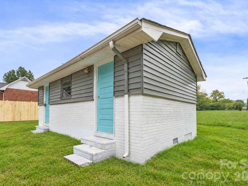 807 Cedar Street, East Spencer, NC 28039.  MLS# CAR4431367, YatesRealty ID 55096. Virtually staged grass, Shed conveys as is