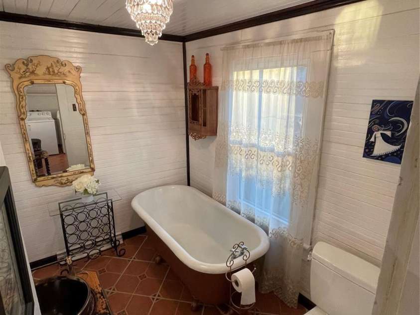 801 3rd Street, Spencer, NC 28159.  MLS# CAR4238622, YatesRealty ID 5510. Clawfoot tub and vintage vanity 